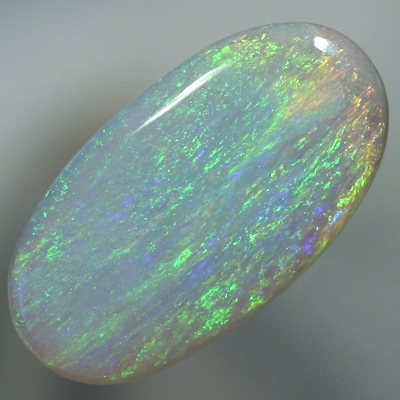SOLID SEMI BLACK OPAL Iris pattern, green and orange over blue